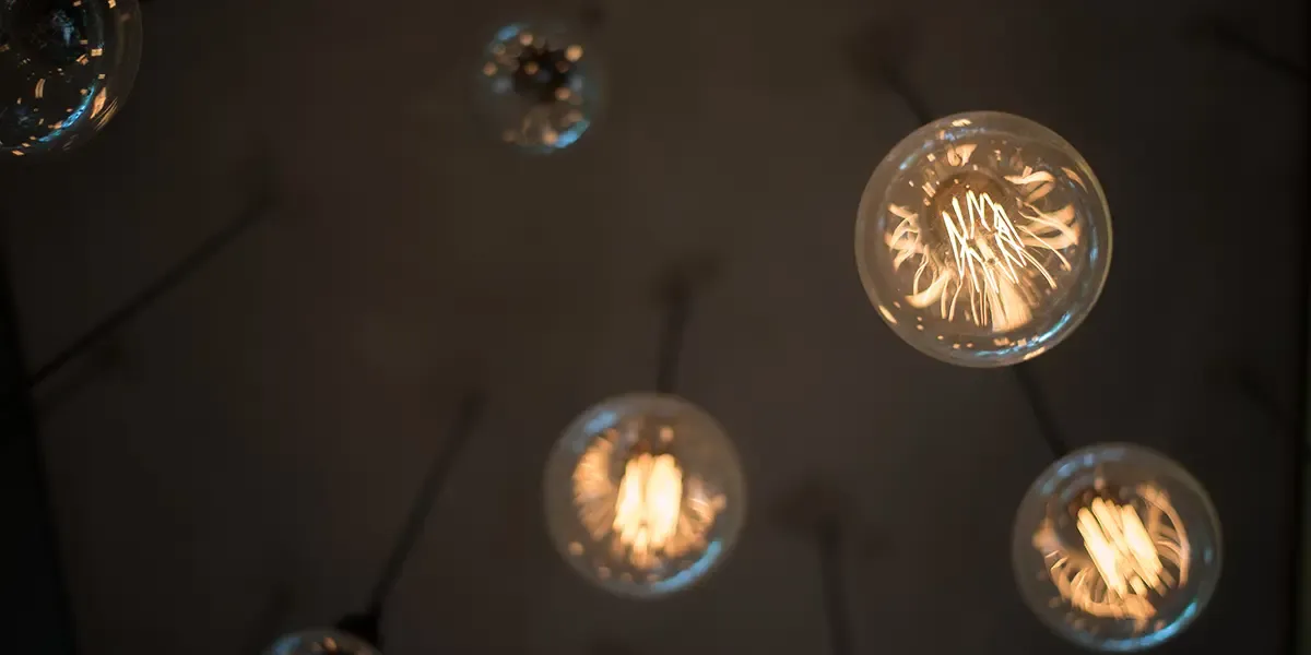 looking up a vintage Lightbulbs hanging from a ceiling
