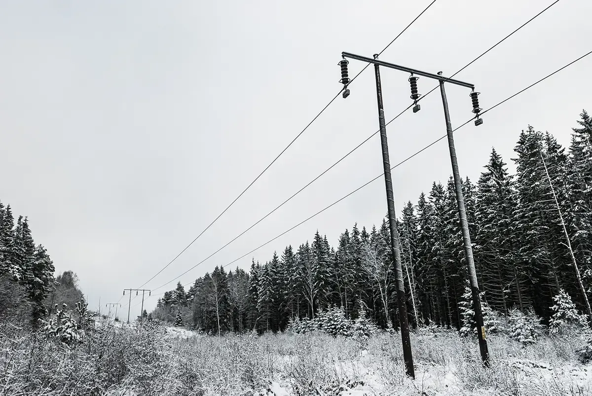 large power lines covered in ice and snow