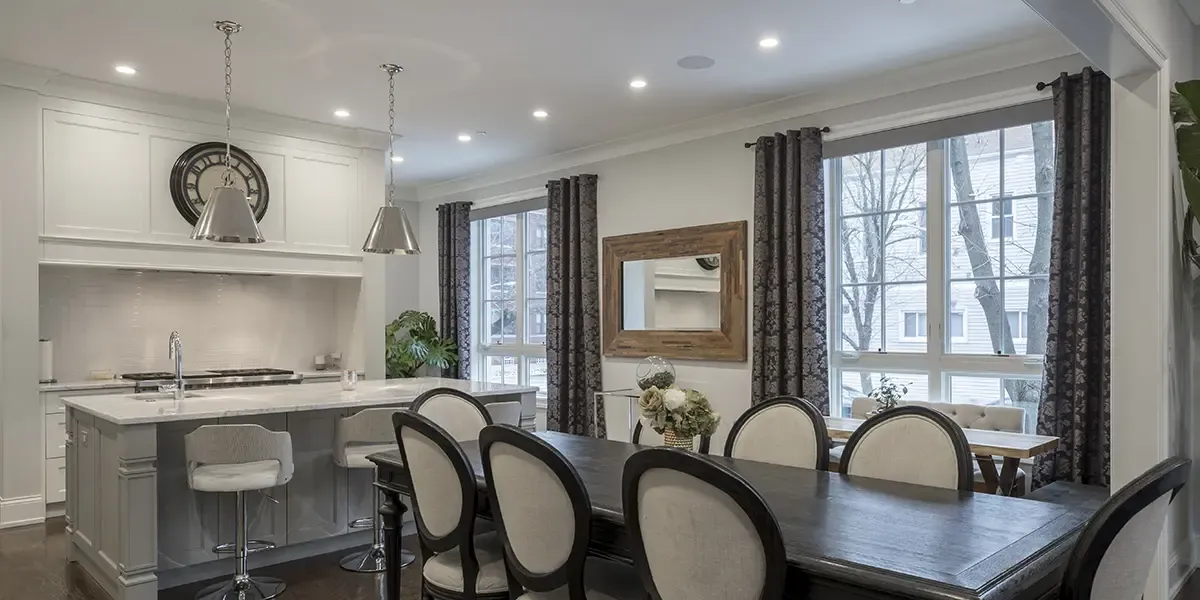 A dining room with recessed lighting overhead